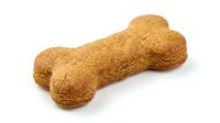 Dog treat bone-shaped biscuit with golden-brown crispy texture, isolated on white background. Suitable for pet food packaging, veterinary websites, and animal care marketing materials.