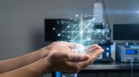 Digital network data flows from open palm with glowing geometric connections and lines, representing technology transfer, cloud computing, and wireless data exchange in modern business environments.
