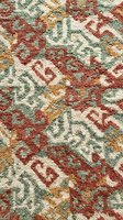 Traditional oriental carpet texture with intricate floral patterns in red, green, and gold colors for interior design and home decor projects.
