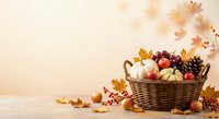 Autumn harvest basket filled with pumpkins, apples and seasonal decorations on warm background with falling leaves and copy space for thanksgiving designs.