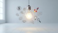 Glowing light bulb with business icons floating around representing innovation, creativity and entrepreneurship concepts for startup presentations.
