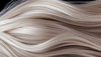 Flowing strands of platinum blonde hair texture with gentle waves and highlights creating smooth curves and natural movement pattern. Macro close up view.