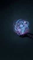 Glowing holographic atomic structure floating above open palm with bright energy particles and light effects on dark background for technology concepts.