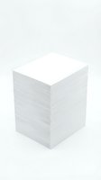 Stack of white blank paper sheets isolated on light background for office and business documentation needs.