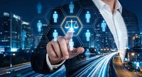 Professional businessman touching digital justice scale icon with human network connections over modern city background at night.
