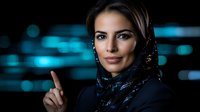 Young Middle Eastern woman in hijab and business attire pointing upward against blue bokeh background, expressing confidence and leadership in modern workplace setting.