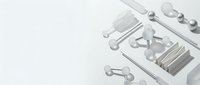 Isolated dental tools and instruments arranged on white surface for medical and healthcare design projects.