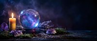 Mystical fortune telling setup with glowing crystal ball, burning candle, amethyst crystals and lavender herbs on dark atmospheric background for divination.