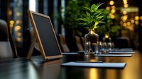 Empty chalkboard menu on wooden restaurant table with green plant in bottle, warm ambient lighting creates cozy atmosphere for dining experience.