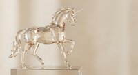 Crystal clear glass unicorn figurine sculpture with flowing mane and tail, elegant mythical creature decoration for home interior design and fantasy collectibles.