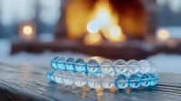 Clear dental aligners on wooden surface with warm fireplace bokeh in background creating cozy atmosphere for orthodontic treatment concept.