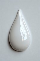 Glossy white teardrop shape with smooth surface and reflective highlights on light gray background, isolated object for design and creative projects.