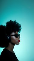 Stylish African American woman with afro hairstyle wearing sunglasses and headphones against turquoise gradient background for music and lifestyle content.