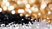 Glowing hexagonal bokeh lights creating magical atmosphere against dark background, soft focus golden and white sparkles for festive mood and celebrations.