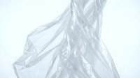 Translucent plastic bag floating against white background, suitable for environmental awareness campaigns, recycling education, and sustainability marketing materials.