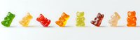 Colorful gummy bears candy in row on white background, sweet gelatin jelly bears isolated for confectionery and food design projects.