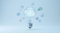 Light bulb with brain inside surrounded by business icons representing innovation and creative thinking for marketing strategies and entrepreneurship.