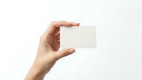Hand holding blank white business card mockup against clean background for branding and corporate identity design projects.