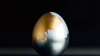 Cracked golden egg with metallic surface revealing silver interior against dark background symbolizing breakthrough and transformation concepts.