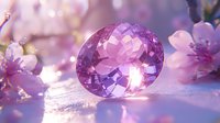 Sparkling purple amethyst crystal against soft pink cherry blossoms in dreamy light, creating magical spring atmosphere with natural bokeh effect and gentle reflections.