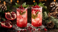 Festive pomegranate cocktails garnished with mint leaves and berries, served in tall glasses with ice against dark background with pine cones and winter decor.