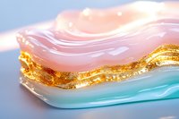 Abstract fluid art with flowing pink, turquoise and gold waves creating luxurious marble effect. Elegant design background for modern decor and creative projects.