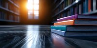 Colorful stacked notebooks on wooden table in library with sunlight through window creating atmospheric mood. Books in blur background create study atmosphere.