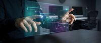 Businessman hands interacting with futuristic holographic interface displaying data analytics and digital graphs in modern office environment.