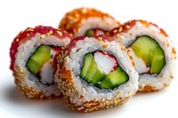 Fresh sushi rolls with cucumber, crab meat, and sesame seeds on white background. Close-up view shows rice, nori wrapper and colorful ingredients.