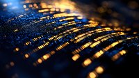 Glowing golden and blue digital wave pattern with bokeh light effects creates futuristic technology background with selective focus and depth of field.