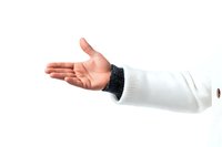 Outstretched hand of a light-skinned person wearing white sweater with black cuff detail, isolated on white background. Clean studio shot for design projects.