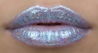 Glamorous holographic glitter lips with iridescent shimmer makeup for beauty fashion cosmetics and party looks.