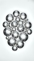 Transparent glass spheres of varying sizes arranged in organic cluster formation on white background, isolated for design and overlay applications.