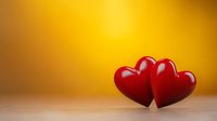 Two red glossy hearts on wooden surface against warm yellow background, romantic Valentine's Day concept for greeting cards and love declarations.