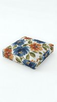 Square floor cushion with navy, rust, and gold floral pattern on cream background. Ideal for home decor, seating, and interior design projects.