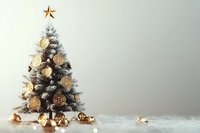 Frosted Christmas tree decorated with golden Bitcoin ornaments and star topper on light background with bokeh lights and copy space for holiday message.