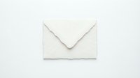 Handmade paper envelope with torn deckle edges on white background, rustic texture for wedding stationery, invitations, and correspondence.