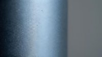Metallic blue surface with fine texture and subtle scratches creating industrial background for modern design projects and contemporary presentations.
