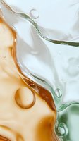 Abstract fluid art with flowing orange and green liquid patterns creating organic shapes with bubbles for modern design backgrounds.