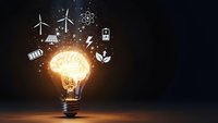Glowing light bulb with sustainable energy icons floating above on dark background representing green technology innovation and environmental solutions.
