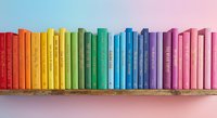 Colorful rainbow books arranged on wooden shelf against gradient background. Library organization concept for education and reading materials.