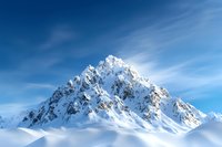 Majestic snow-covered mountain peak rising against vibrant blue sky with wispy clouds, dramatic winter landscape showcasing pristine alpine wilderness.