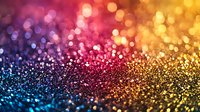 Vibrant multicolored bokeh background with glowing defocused lights in blue, pink, purple and gold creating magical sparkle effect for festive designs and celebrations.