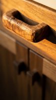 Handcrafted wooden furniture detail showing natural wood grain texture and traditional joinery craftsmanship for interior design projects.