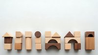 Wooden building blocks arranged in row showing various geometric shapes and architectural elements for educational play and creative construction.
