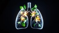 Glowing anatomical lungs with green leaves and luminous highlights on black background, medical concept showing connection between nature and human health.