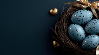 Decorative blue Easter eggs with gold polka dots arranged in natural twig nest with golden ribbon and small metallic ornaments on dark background.