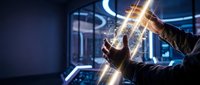 Hands holding glowing neon light tubes in modern tech environment, suitable for technology, innovation, and digital transformation concepts.