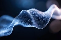 Glowing blue wave of particles flowing in dark space creates mesmerizing abstract pattern with sparkles and light effects for technology backgrounds.
