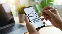Customer magnet concept on smartphone screen with hands holding device, digital marketing strategy for attracting clients online business growth.